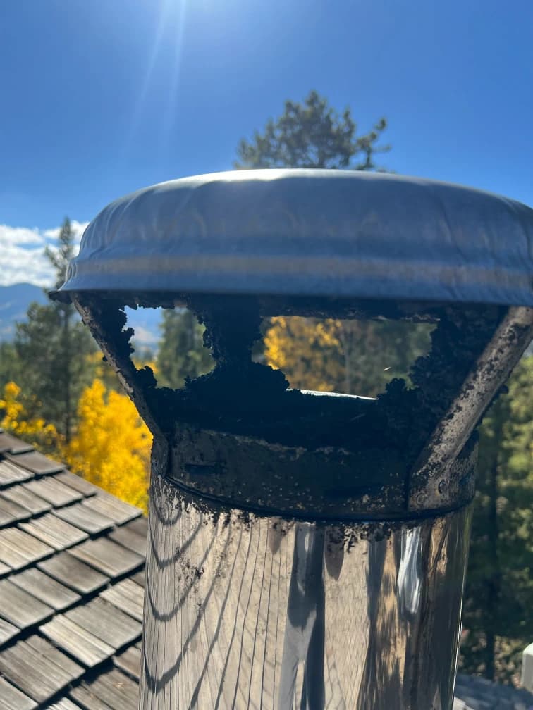 Blocked chimney cap with mountain view