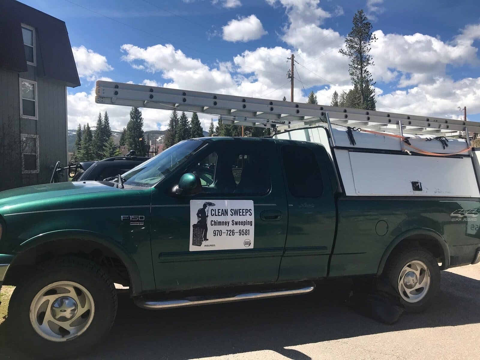 Clean Sweeps' green Ford F-150 service truck with ladder rack